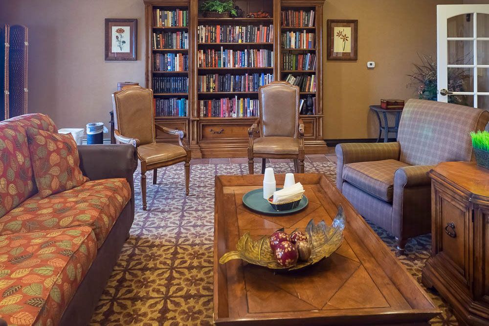 Interior of Home Decor senior living community in Alamosa featuring cozy living room with wooden furniture.