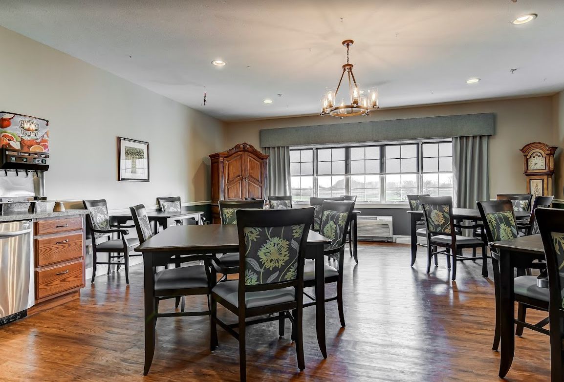 Senior living community, River Birch Living South Campus, featuring elegant dining room with hardwood floors.
