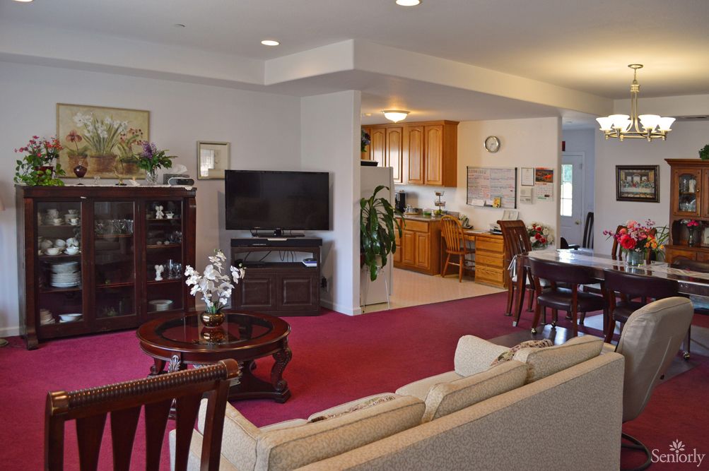 Interior view of Judy's Homes For The Elderly on 28th Ave, showcasing a well-furnished living and dining area.