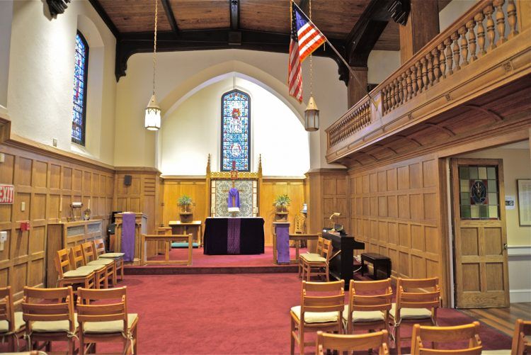 Interior view of Saint Elizabeth Court senior living community featuring chapel, furniture, and art.