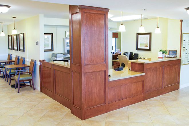 Interior view of Brookdale Loma Linda senior living community with wooden furniture and decor.
