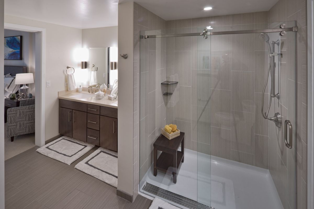 Interior design of a spacious bathroom with shower in Viamonte at Walnut Creek senior living community.