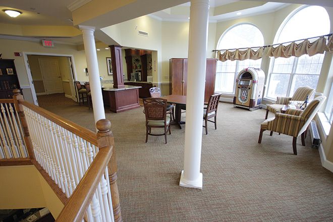 Interior view of Brookdale Ann Arbor senior living community featuring wooden architecture and furniture.