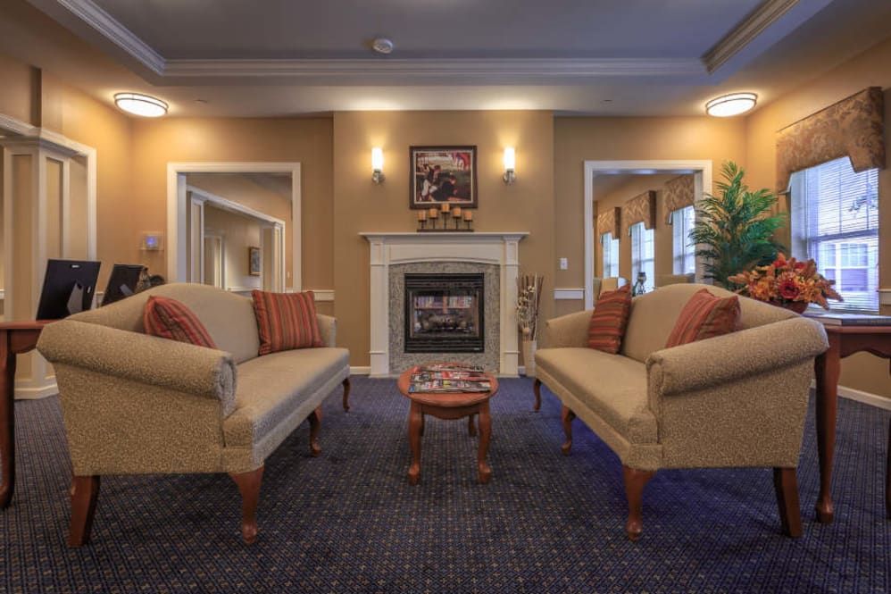 Senior enjoying cozy living room with modern decor at All American Assisted Living, Washington Township.