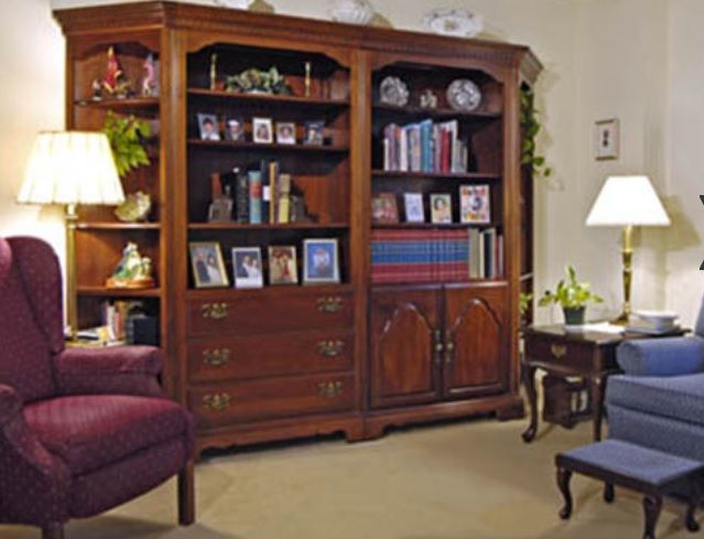 Senior living room at United Methodist Communities At Pitman featuring furniture, art, and plants.