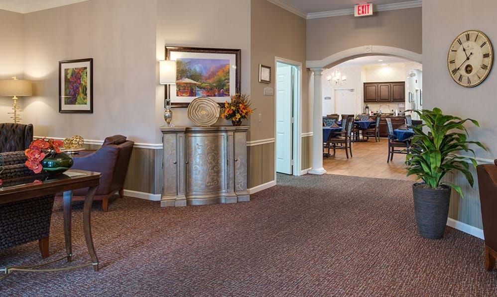 Senior living community Hickory Gardens, showcasing a well-furnished dining room with elegant home decor.