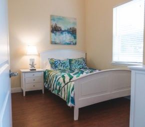 Interior design of a cozy bedroom with furniture and home decor at Angels Senior Living in Sarasota.
