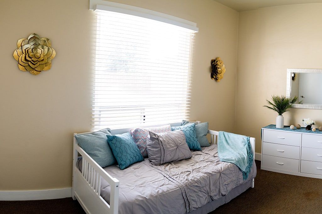 Interior view of a cozy bedroom at Astoria Senior Living at Oakdale with stylish decor.