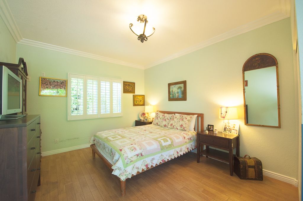 Interior view of a bedroom in Raya's Paradise senior living community with elegant decor.