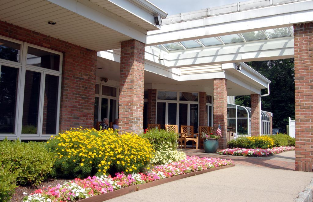 Senior living community, The Chelsea at Montville, featuring lush gardens and modern architecture.
