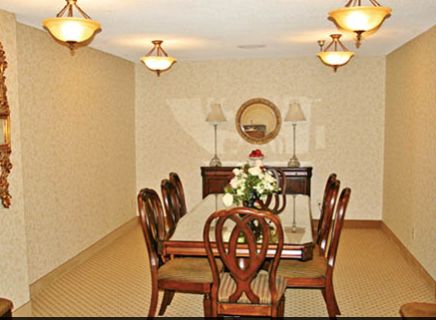 Interior view of Linda Valley Villa senior living community featuring dining room with elegant furniture.