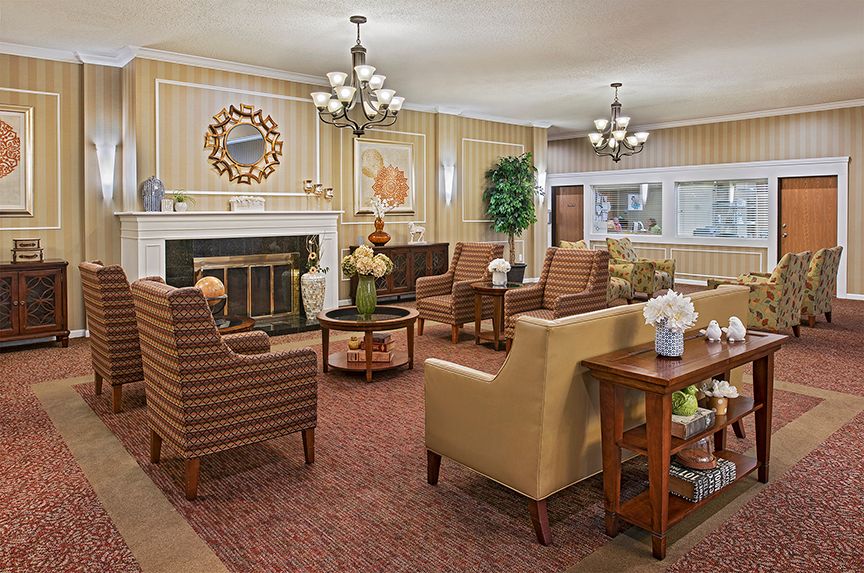 Interior view of American House Livonia senior living community featuring stylish decor and furniture.