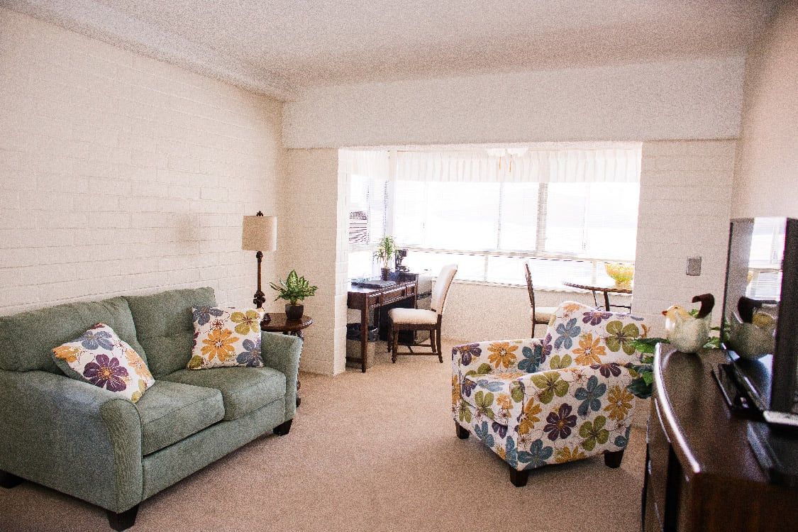 Interior view of Rowntree Gardens senior living community featuring cozy living and dining areas.