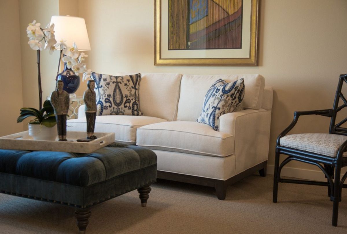 Senior enjoying comfortable living room with modern furniture at Aegis Living San Rafael.
