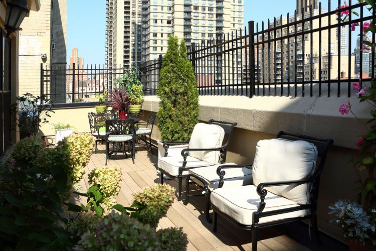 80th Street Residence, a senior living community with scenic city views, balcony gardens, and outdoor furniture.