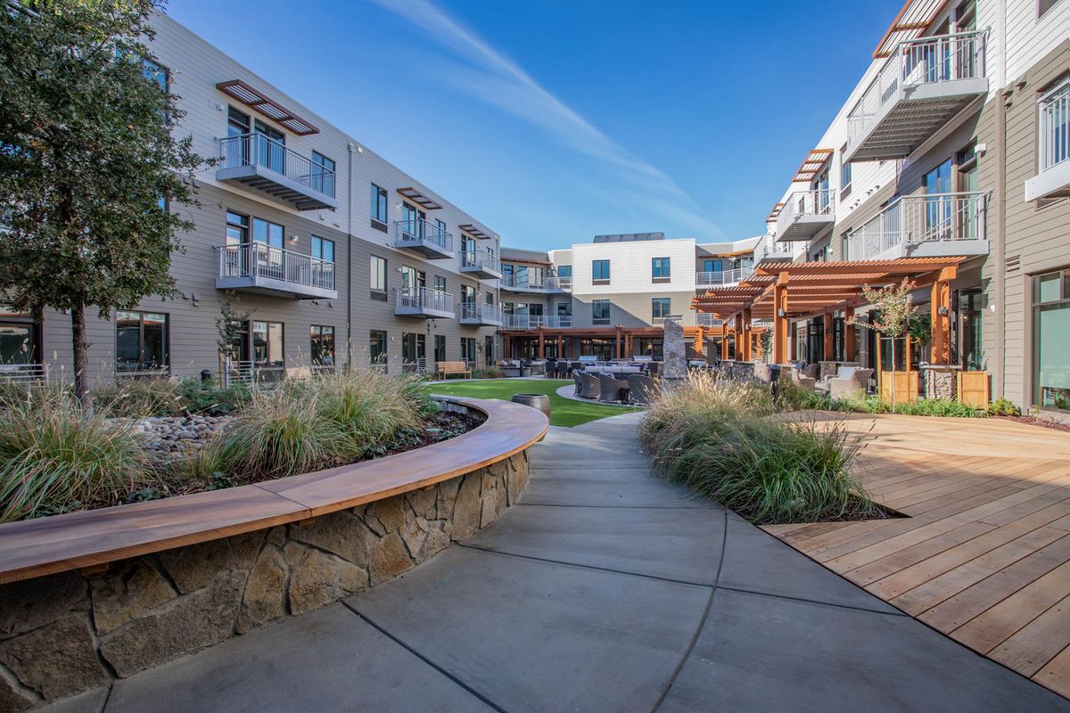 Senior living community, The Watermark at Napa Valley, featuring urban architecture and suburban housing.