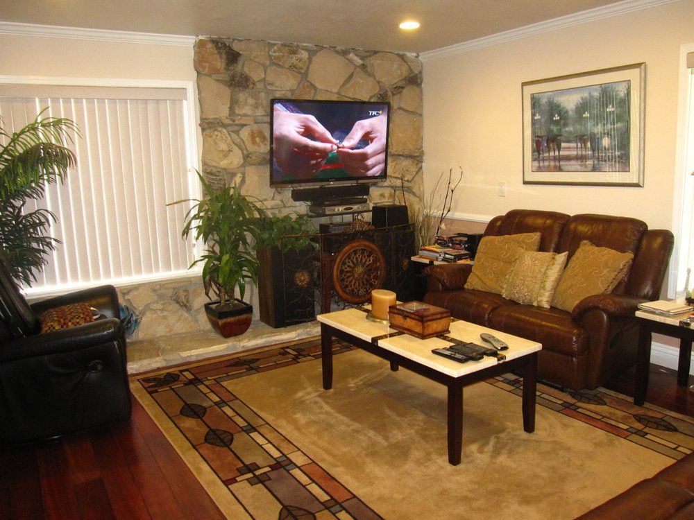 Senior living room interior with modern furniture, electronics, and cozy decor in a quality community.