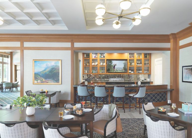 Interior view of Vi at The Glen senior living community featuring dining room with elegant decor.