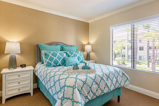 Interior design of a cozy bedroom at Brookdale Irvine senior living community with elegant furniture.