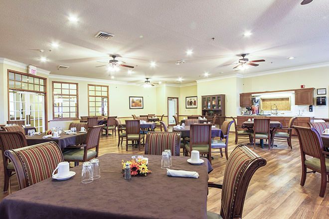 Interior view of Brookdale Falling Creek senior living community featuring dining area and architecture.