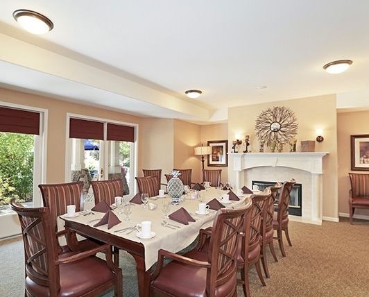Interior view of Brookdale Windsor senior living community featuring dining room, art, and decor.