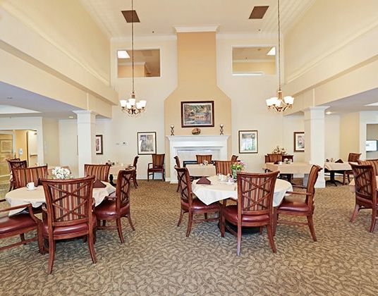 Interior view of Brookdale Windsor senior living community featuring dining area and reception room.