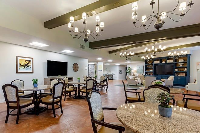 Interior view of Brookdale Sarasota Midtown senior living community featuring dining area and decor.