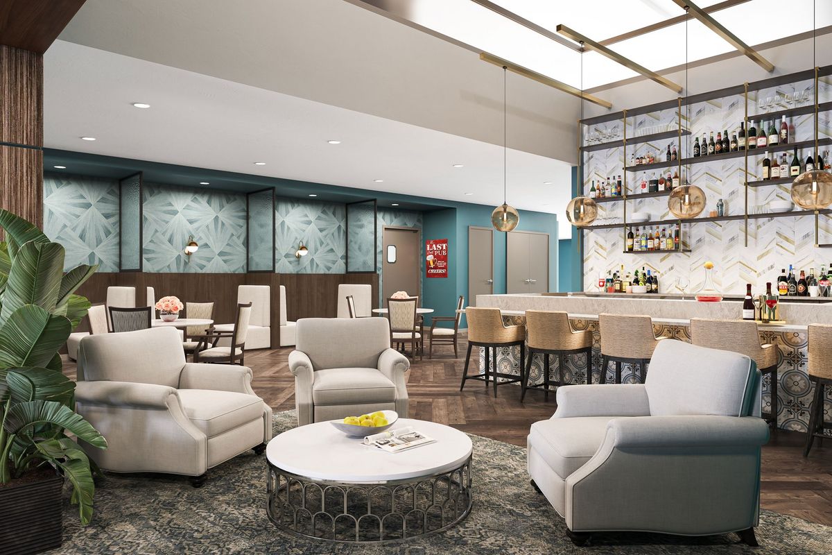 Senior living community interior at The Gallery At North Port featuring lounge, dining room, and decor.