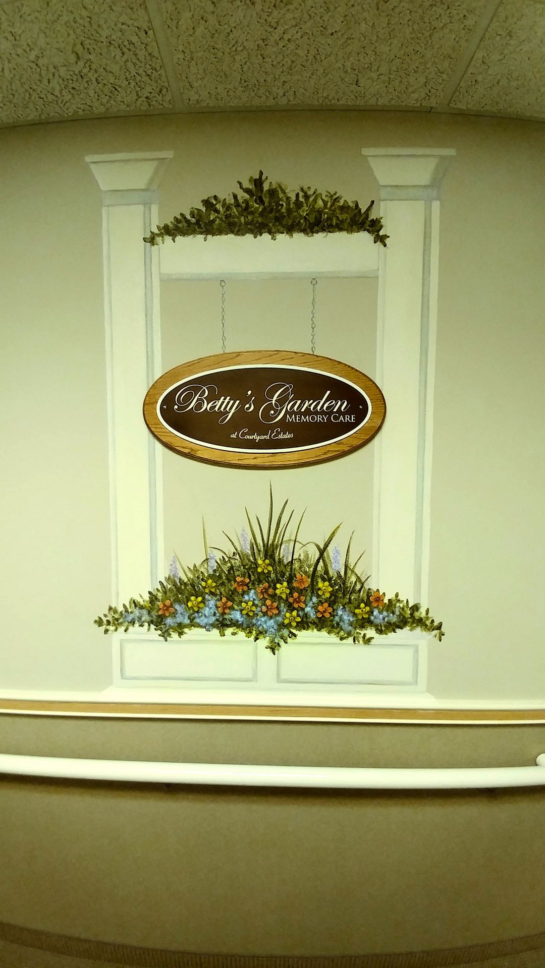 Senior living community, Courtyard Estates of Bushnell, featuring floral arrangements, art, and pottery.