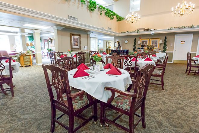 Senior living community, Sterling Court at Roseville, featuring elegant dining room with chandelier.