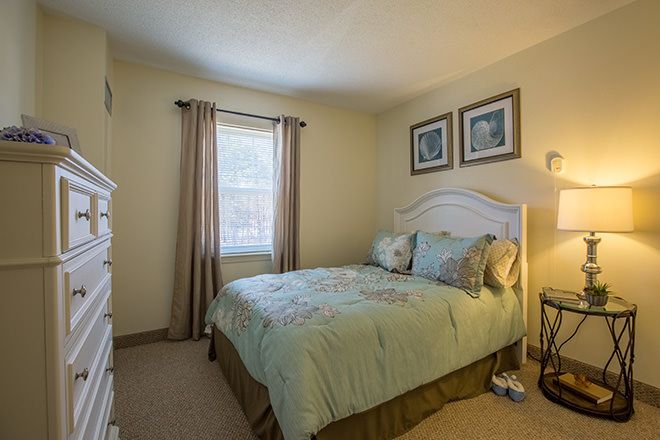 Interior view of a cozy bedroom at Brookdale Cape Cod senior living community.