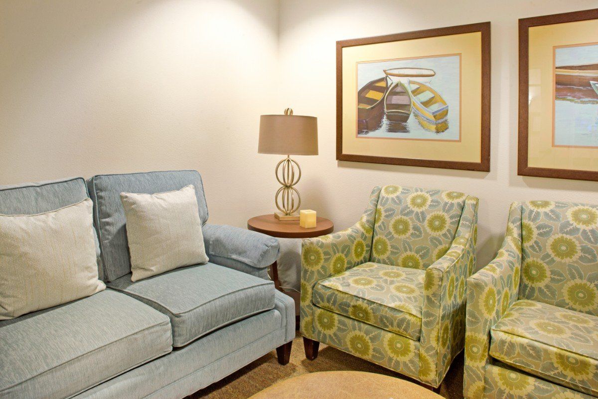 Senior living room at Ivy Park at Wood Ranch featuring cozy furniture and home decor.