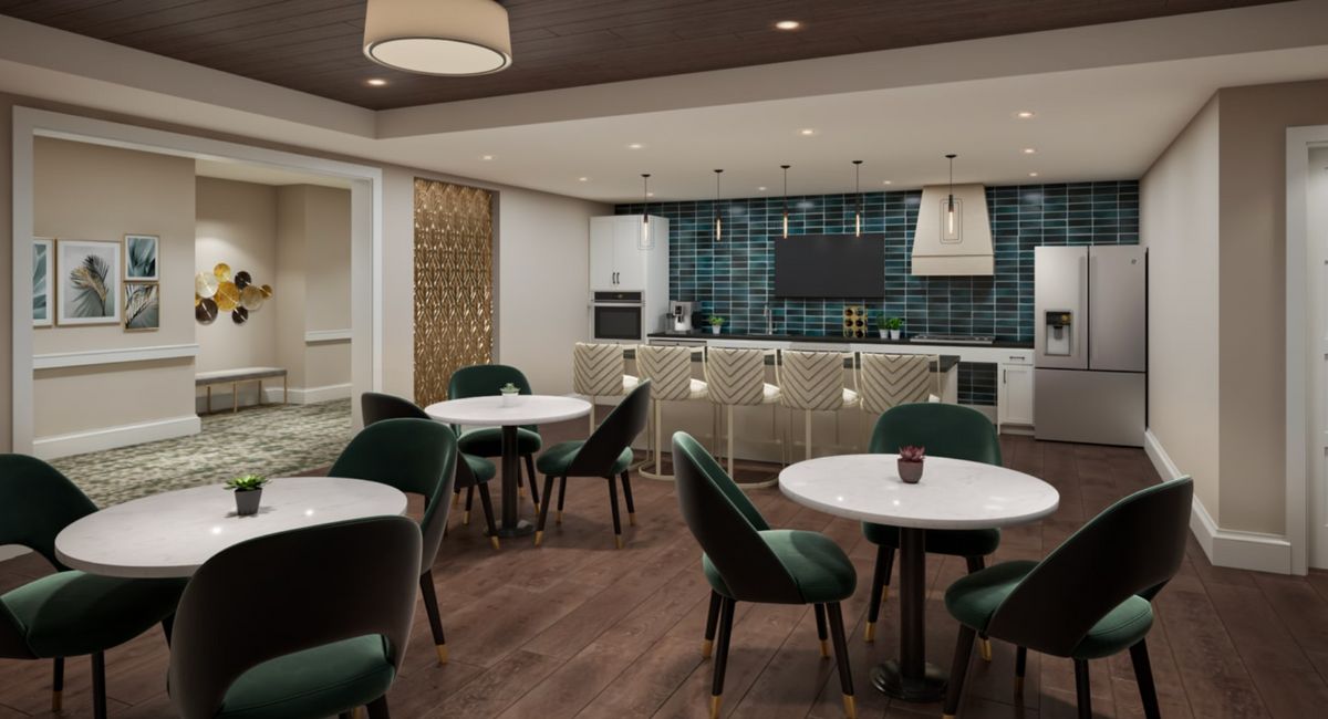 Senior living community interior at The Residence at Bedford featuring dining area and lounge.