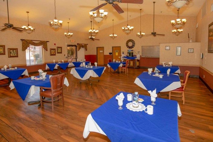 Elegant dining room at Citadel Post Acute senior living community with hardwood flooring.
