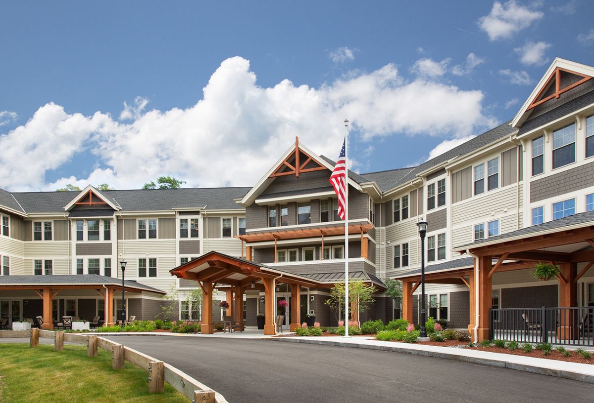 Senior living community, The Residence at Orchard Grove, showcasing urban architecture in a suburban neighborhood.