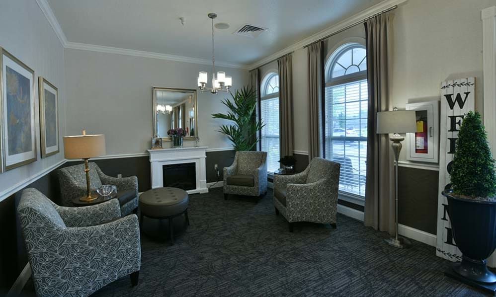 Interior view of Foxberry Terrace Senior Living with elegant furniture, art, and home decor.