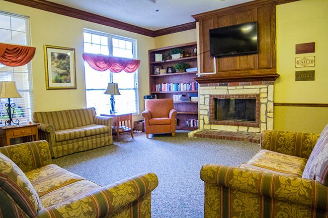Interior view of Brookdale Goodlettsville senior living room with modern decor, furniture, and electronics.