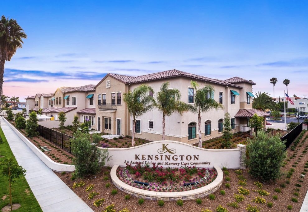 Senior living community, The Kensington Redondo Beach, featuring houses, cars, and residents.
