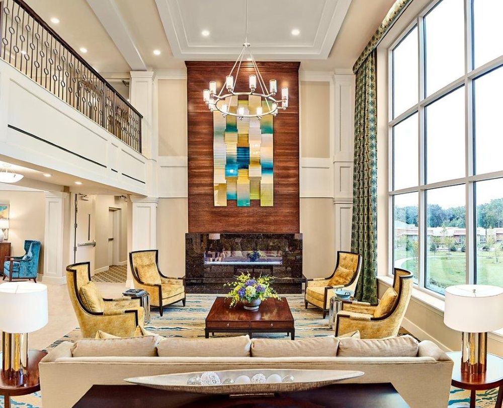 Interior view of The Sheridan At Green Oaks senior living community featuring elegant decor and furniture.