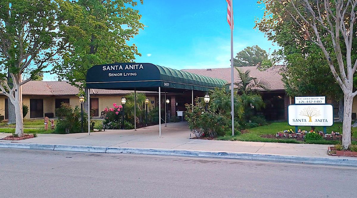 Santa Anita Assisted Living community featuring urban architecture, lush vegetation, and outdoor spaces.