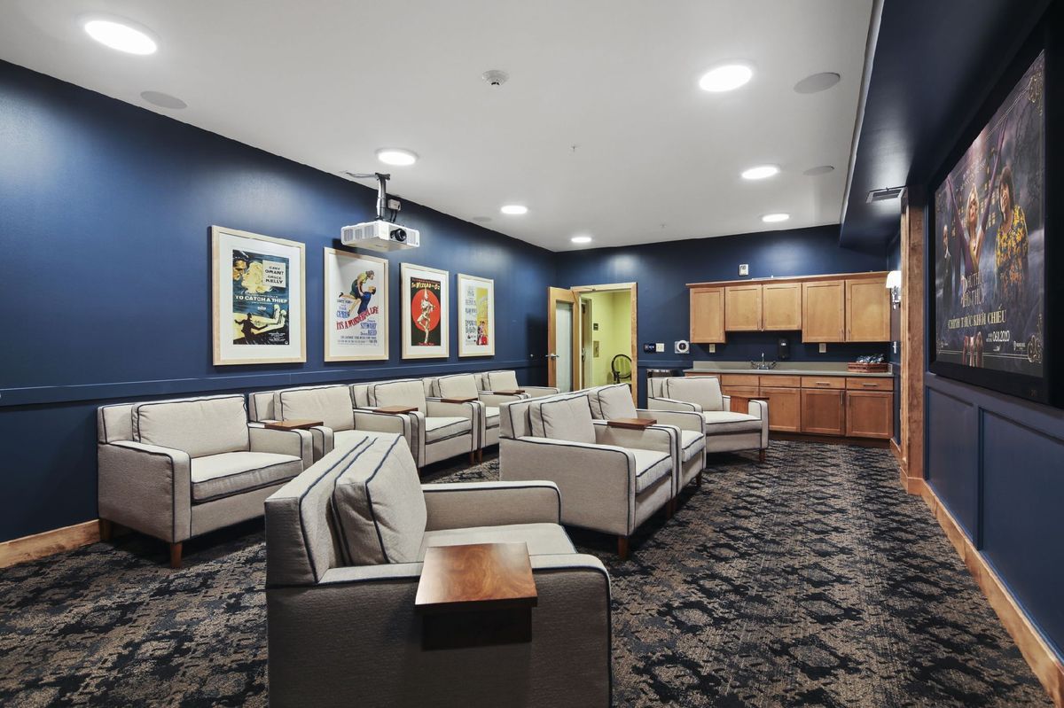 Senior living community lounge at The Waters On 50th featuring modern decor, art, and architecture.