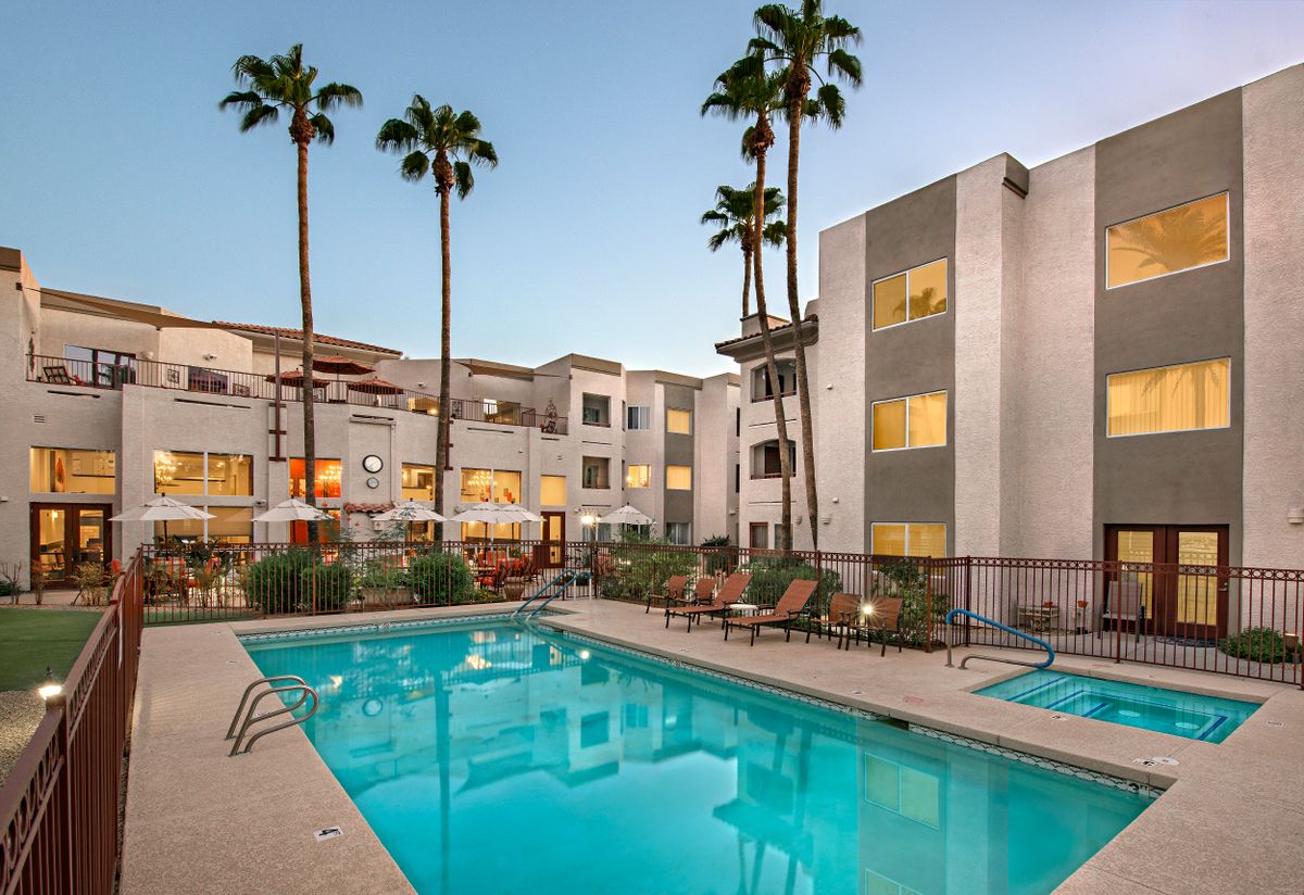 Senior living community at The Ranch Estates, Scottsdale featuring condos, pool, and urban greenery.