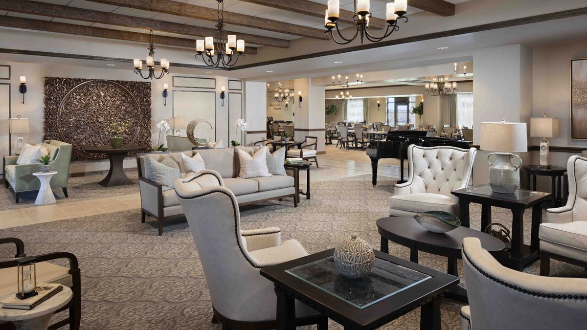 Interior view of Belmont Village Senior Living Aliso Viejo featuring dining room and lounge area.