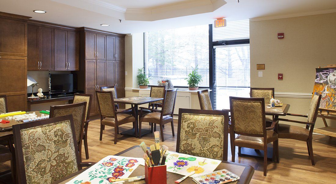 Interior view of Montgomery Village senior living community featuring dining room, kitchen, and decor.