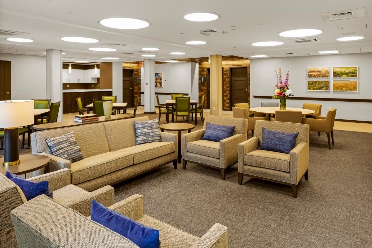 Interior view of Adelaide Senior Living Centre in Newton, featuring lounge furniture, art, and home decor.