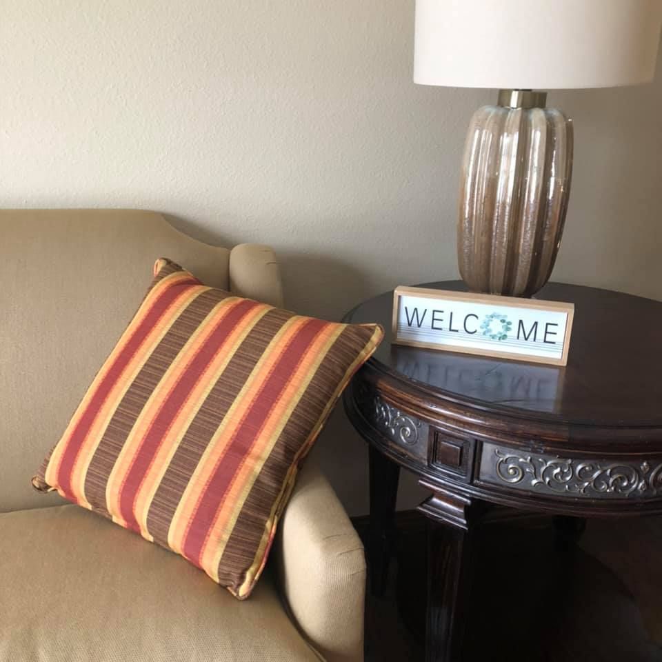 Senior living community Springhouse Village East featuring cushion, home decor, lamp, and accessories.