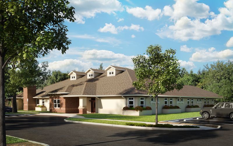Senior living community, Memory Lane Cottage at Tampa Palms, featuring lush greenery and modern architecture.