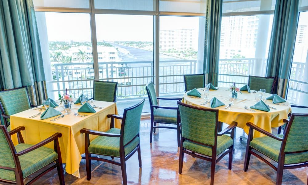 Senior living community, The Meridian At Waterways, featuring dining room with table setup.