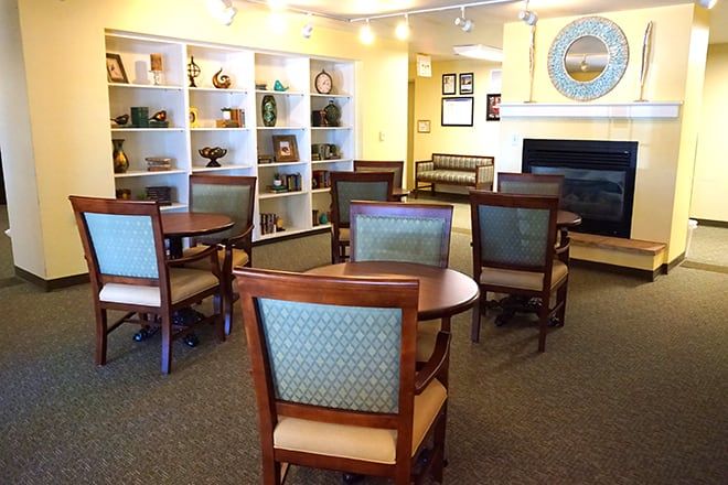 Interior view of Brookdale Midland senior living community featuring dining area, living room, and art.