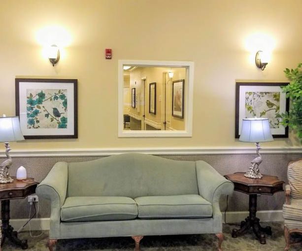 Senior living room at Revere Court of South Barrington with cozy furniture and home decor.